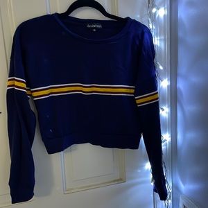Long sleeve navy blue tshirt with yellow and maroon stripe.
